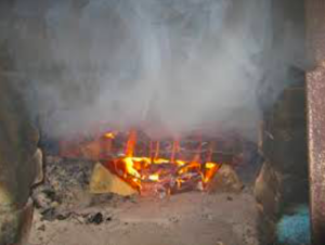 The fireplace smokes into the room