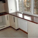 The height of the window sill in the house in the kitchen