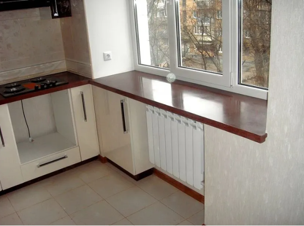 The height of the window sill in the house in the kitchen