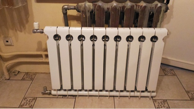 Replacing a cast iron battery with a bimetallic one with your own hands