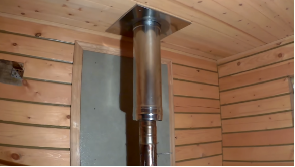 Stove in a bathhouse on a wooden floor 12