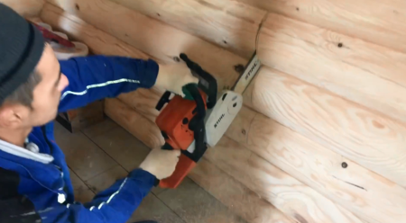 Stove in a bathhouse on a wooden floor 2