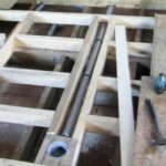 Floor installation in a bathhouse on screw piles
