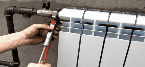 How to hang a radiator on the wall