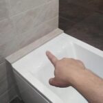 How to connect a bathtub to a wall