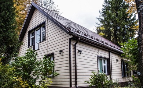 Wind protection under siding